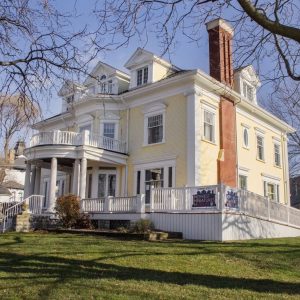 Picture of the outside of the building with columns replaced, ramp installed, and porch repaired